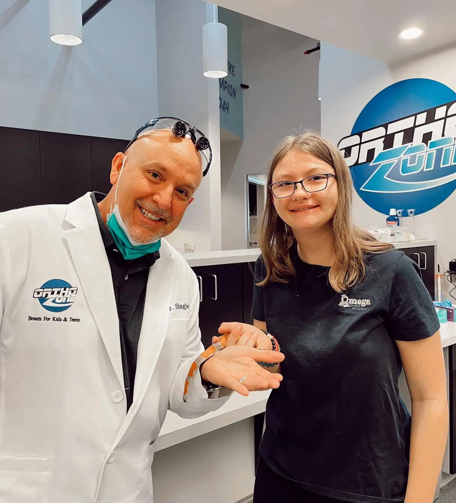 Orthodontist smiling with patient